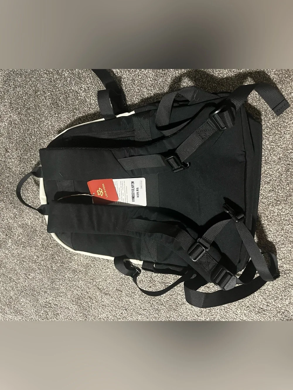 Two-Tone Black and Cream Backpack with Pom Pom Charm